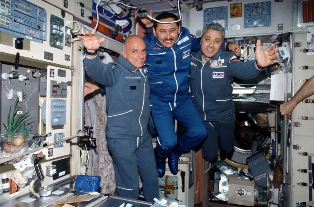 The first space tourist, Dennis Tito (left) aboard the ISS
